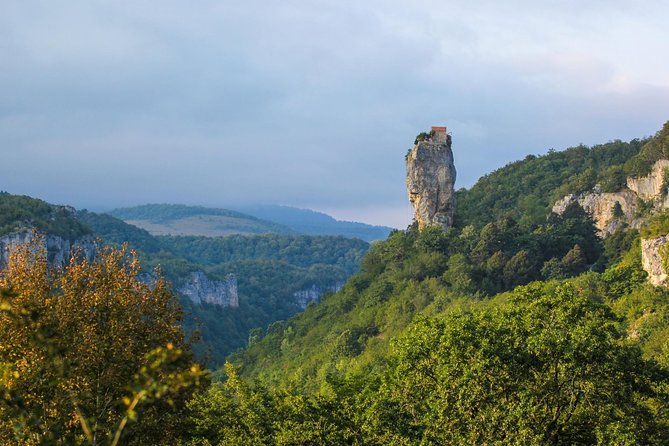 Chiatura and Katskhi Pillar One Day Urbex Tour - Mgvimevi Monastery and Its Cliffside Setting