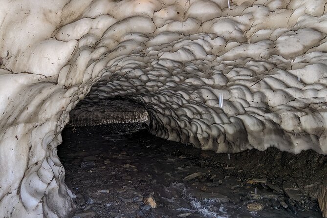 Kazbegi & Gudauri Private Full-Day Tour From Tbilisi - Sno’s stone faces and a local touch