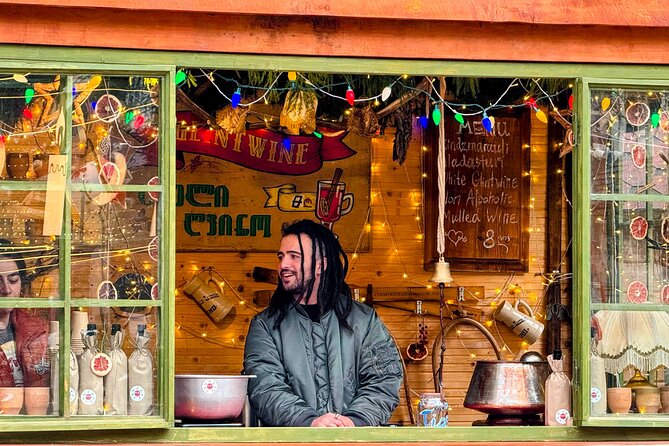 New Year in Tbilisi: Christmas Market and Hidden Gems Tour - Walking Rustaveli Avenue under the New Year lights