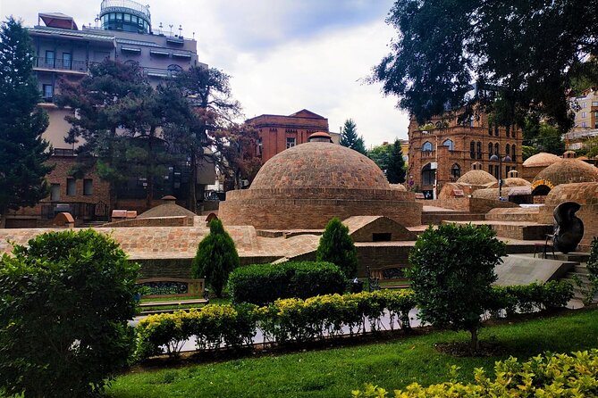 Tbilisi Walking Tour with Cable Car, Wine Tasting & Bread Bite - Narikala Fortress above the old rooftops